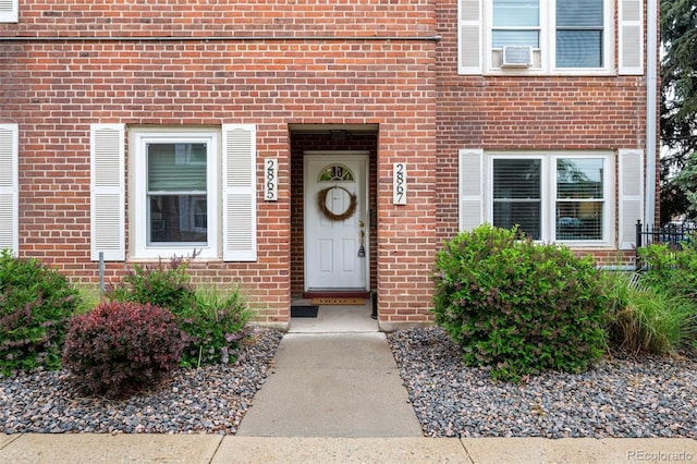 2867 Jasmine St, Denver, CO 80207 - doorway to property featuring brick siding and cooling unit