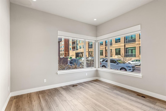 empty room featuring light hardwood / wood-style floors