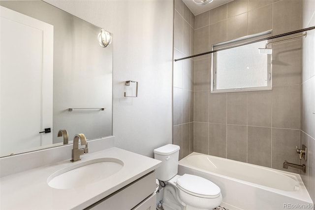 full bathroom featuring vanity, toilet, and tiled shower / bath