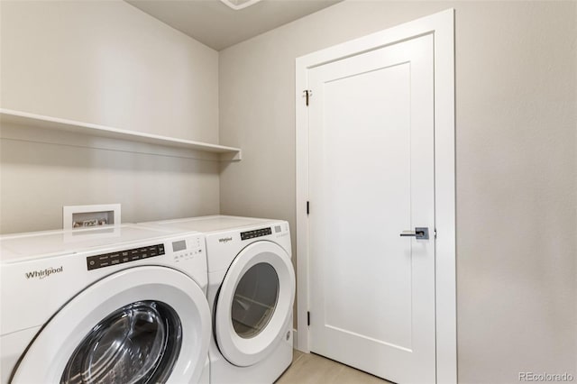 laundry area with washing machine and clothes dryer