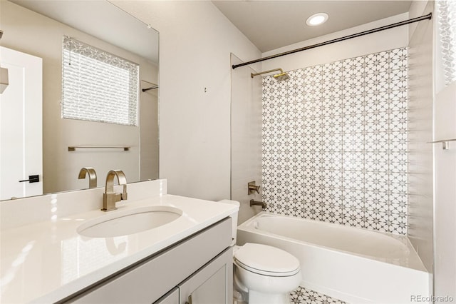 full bathroom featuring vanity, shower / bath combination, and toilet