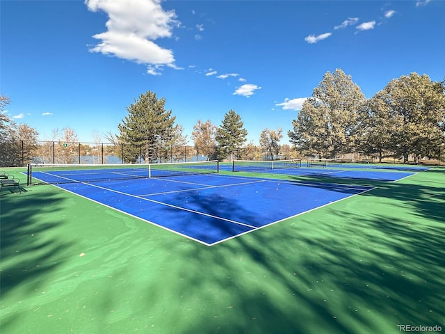 view of sport court with basketball hoop