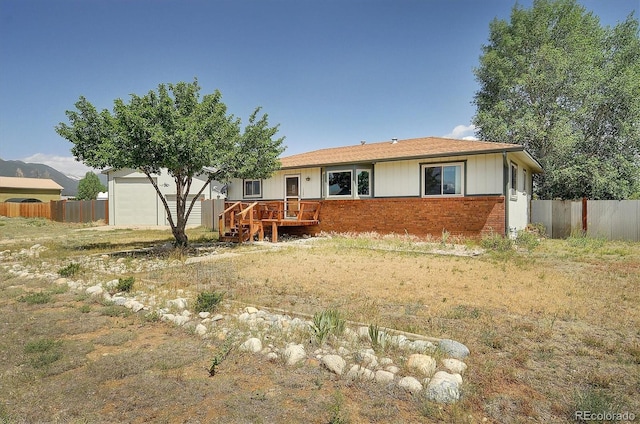 view of front of house featuring a wooden deck