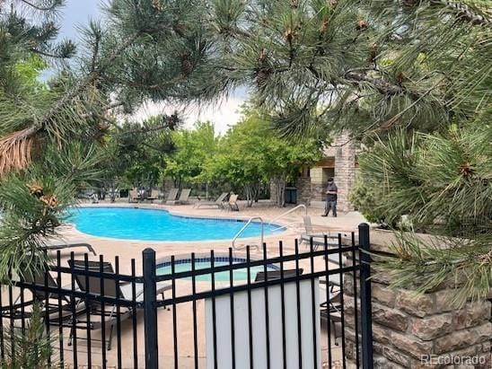 11282 Osage Cir N Unit F, Northglenn, CO 80234 - community pool with a patio