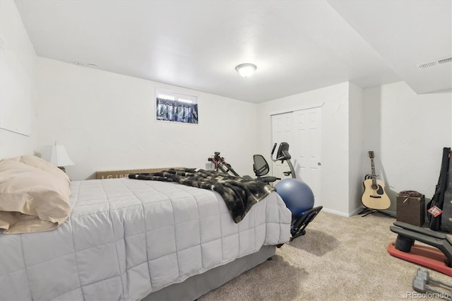 bedroom with carpet floors and a closet