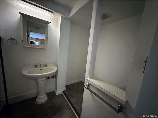 bathroom with tile patterned flooring