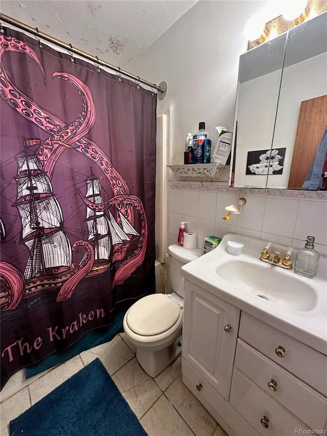 full bathroom featuring tile patterned flooring, tile walls, tasteful backsplash, toilet, and vanity