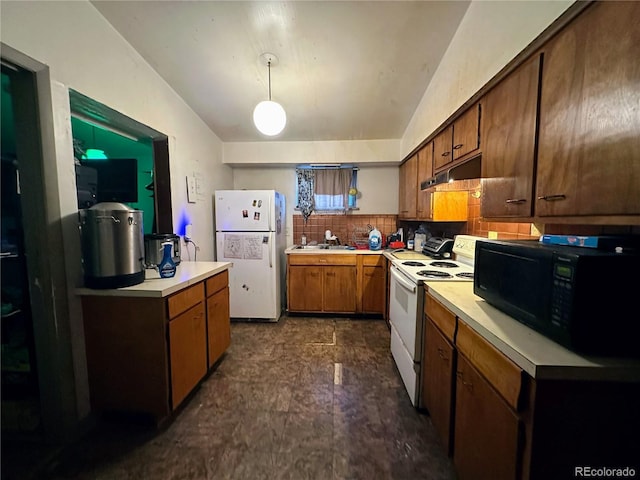 kitchen featuring white appliances, decorative light fixtures, sink, and decorative backsplash