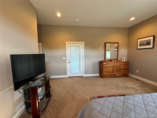 bedroom featuring light colored carpet