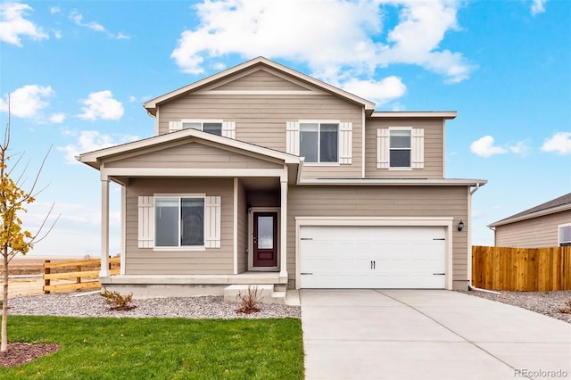 view of front of home featuring a front yard and a garage