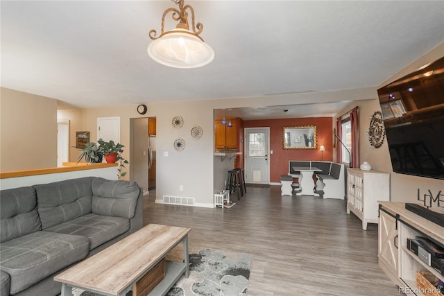 11805 W 74th Ave, Arvada, CO 80005 - living room featuring light wood-style floors and baseboards