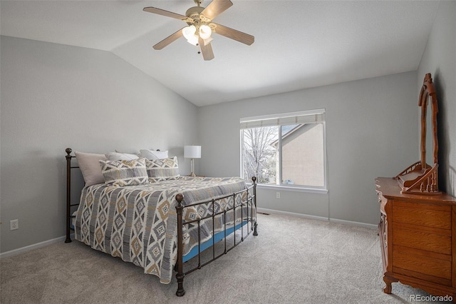 bedroom featuring vaulted ceiling, baseboards, carpet, and ceiling fan