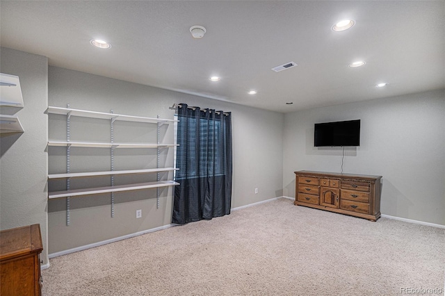 interior space with recessed lighting, visible vents, carpet flooring, and baseboards