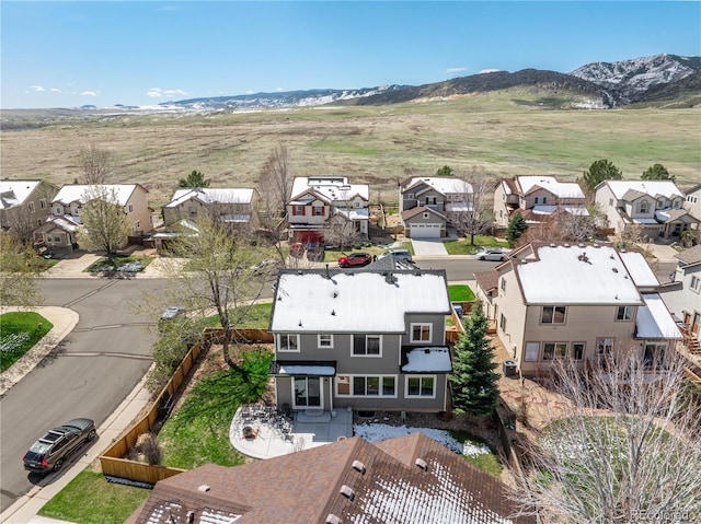 aerial view featuring a mountain view and a residential view