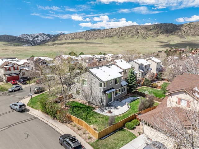 drone / aerial view featuring a mountain view and a residential view