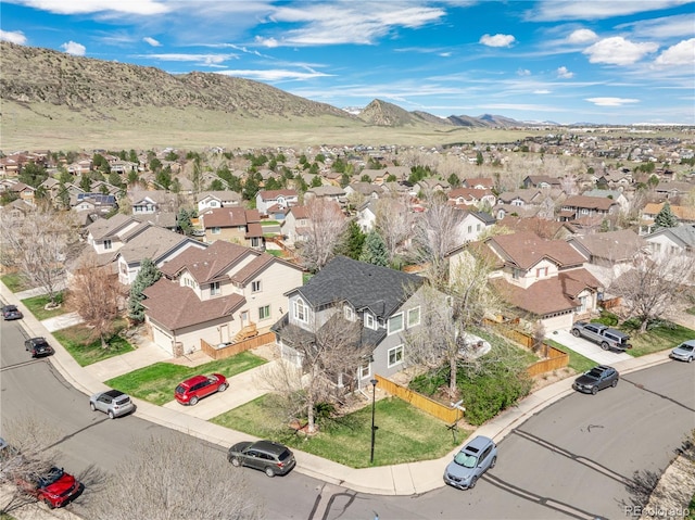 birds eye view of property featuring a mountain view and a residential view