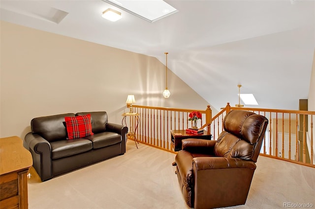 carpeted living room with vaulted ceiling with skylight