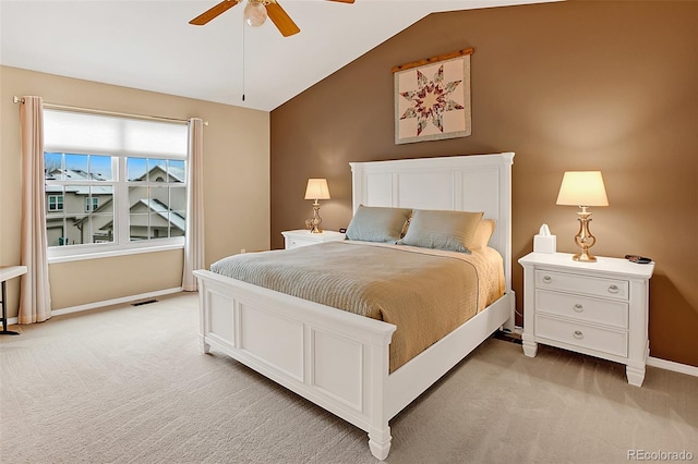 carpeted bedroom featuring lofted ceiling and ceiling fan