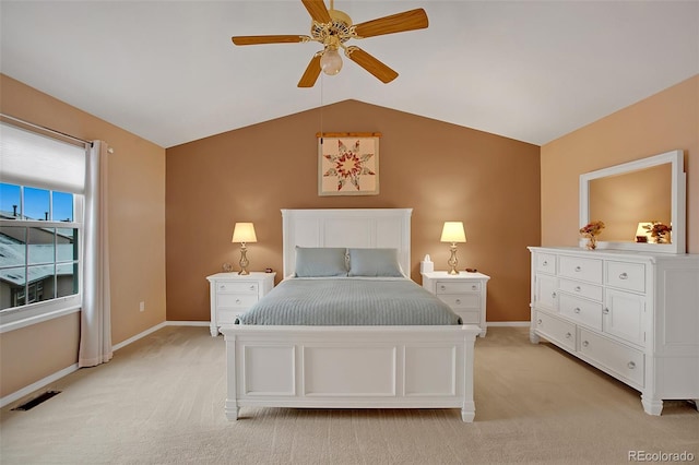 carpeted bedroom with vaulted ceiling and ceiling fan