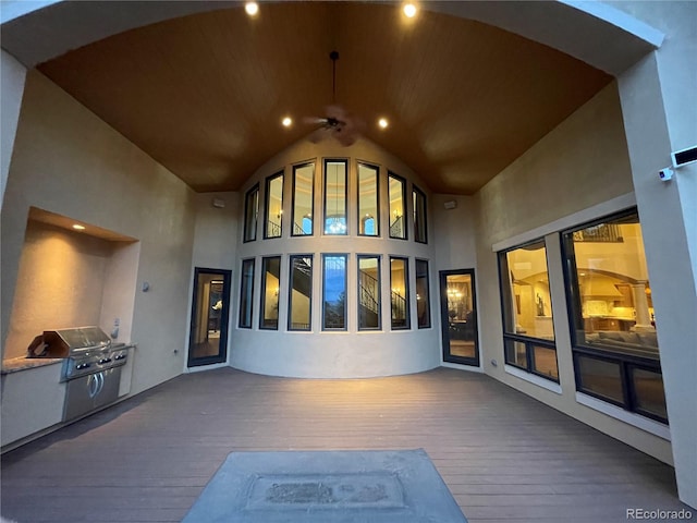 view of patio featuring grilling area, ceiling fan, and a deck