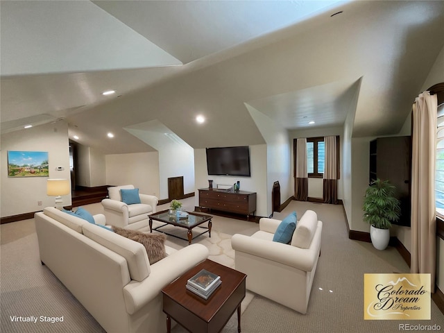 living room featuring light carpet and vaulted ceiling