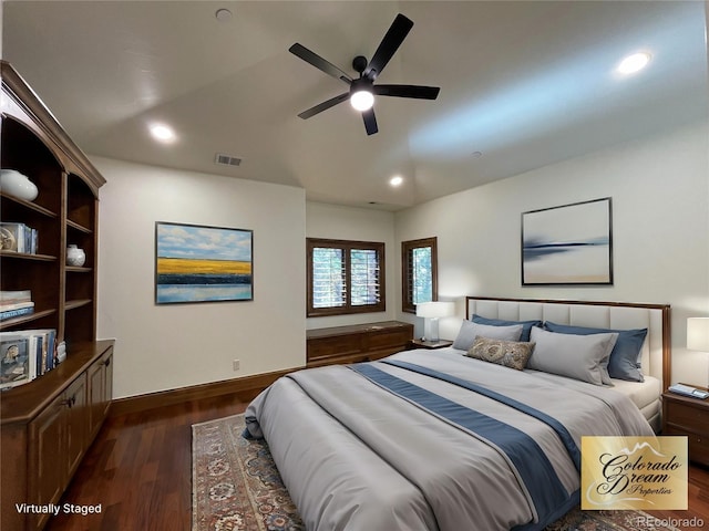 bedroom with ceiling fan and dark wood-type flooring