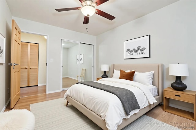 bedroom featuring a closet, baseboards, ceiling fan, and light wood-type flooring