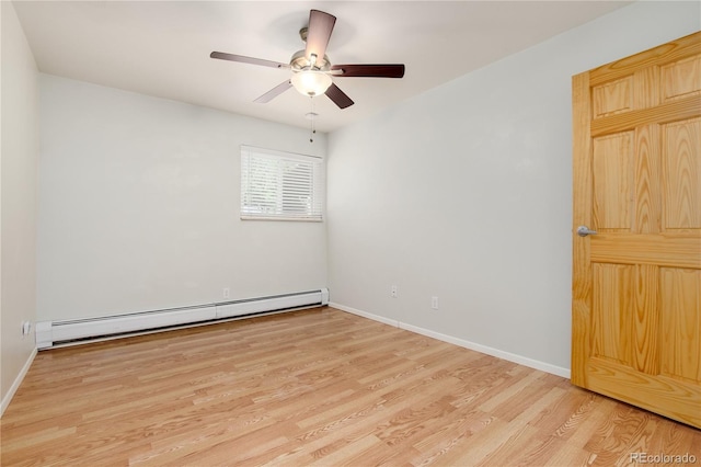 unfurnished room featuring a ceiling fan, baseboards, wood finished floors, and a baseboard radiator