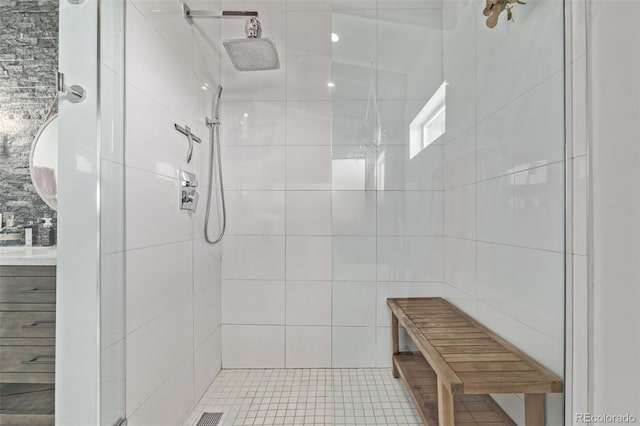 bathroom with tiled shower