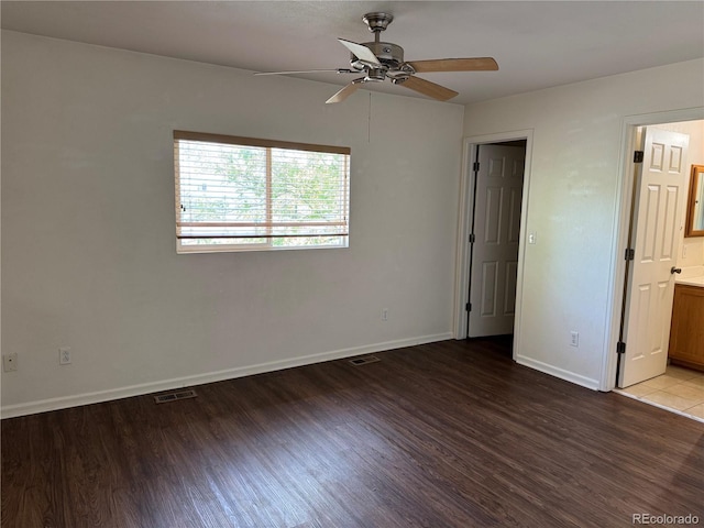 897 Mockingbird Ln, Brighton, CO 80601 - empty room with wood finished floors, ceiling fan, and baseboards