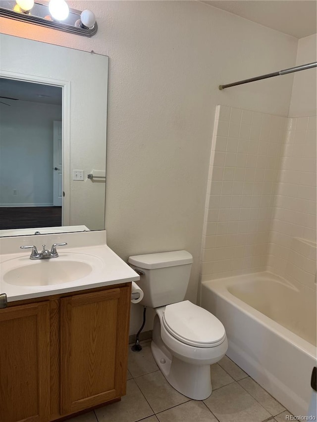897 Mockingbird Ln, Brighton, CO 80601 - full bath featuring toilet, tile patterned flooring, vanity, and shower / washtub combination