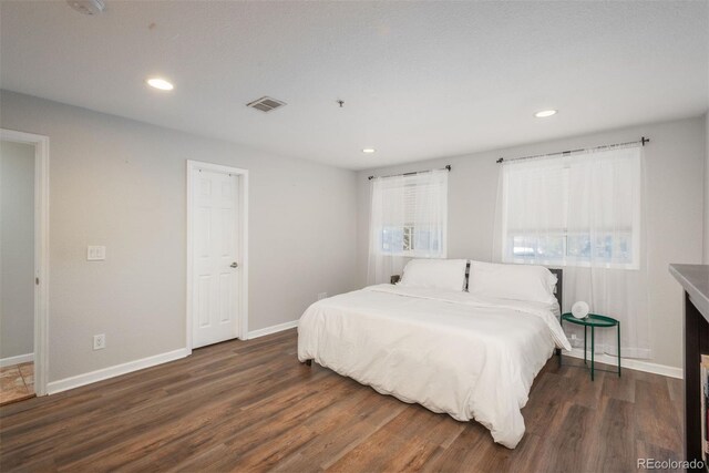 12281 E Tennessee Dr Unit 303, Aurora, CO 80012 - bedroom with wood finished floors and recessed lighting