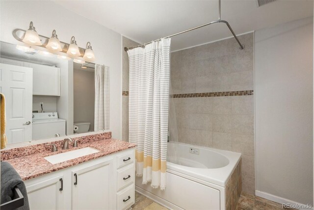 12281 E Tennessee Dr Unit 303, Aurora, CO 80012 - full bathroom featuring washer / dryer, shower / tub combo with curtain, and vanity