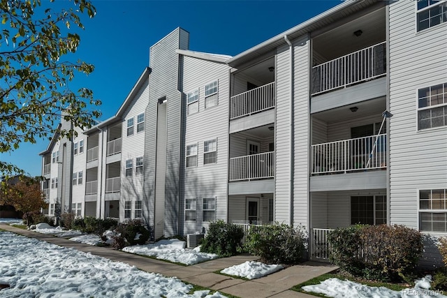 12281 E Tennessee Dr Unit 303, Aurora, CO 80012 - snow covered property with a view of apartment building / complex