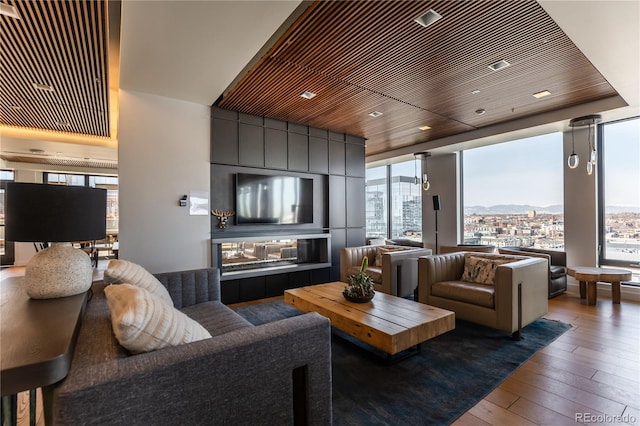 living room with hardwood / wood-style flooring and wooden ceiling