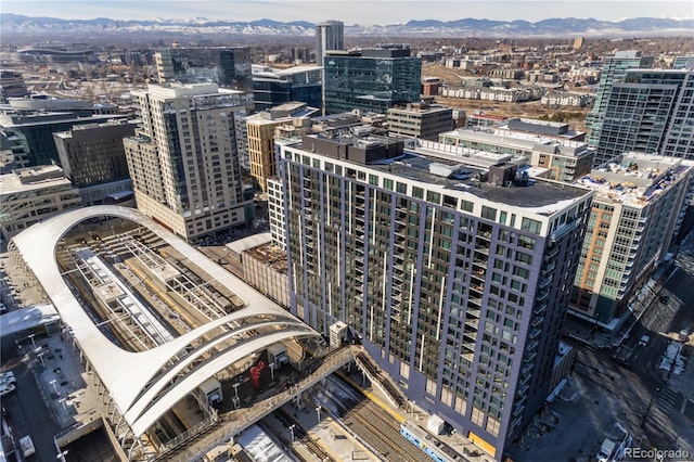 property's view of city featuring a mountain view