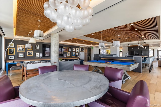 dining area with pool table, a raised ceiling, light hardwood / wood-style flooring, and wooden ceiling