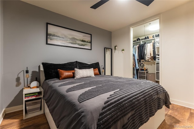 bedroom with hardwood / wood-style floors and a closet