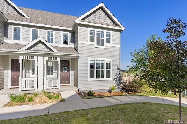 1678 Wright Aly, Erie, CO 80516 - multi unit property featuring covered porch, a shingled roof, and fence