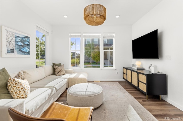 1678 Wright Aly, Erie, CO 80516 - living room featuring dark wood-type flooring, baseboards, and recessed lighting