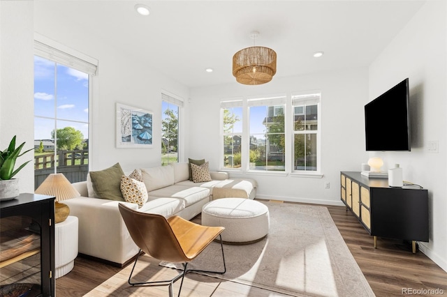 1678 Wright Aly, Erie, CO 80516 - living area featuring wood finished floors, baseboards, and recessed lighting
