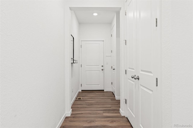 1678 Wright Aly, Erie, CO 80516 - hallway with dark wood-style floors, baseboards, and recessed lighting