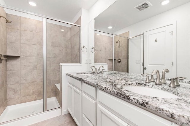 1678 Wright Aly, Erie, CO 80516 - bathroom featuring a shower stall, recessed lighting, tile patterned flooring, and double vanity