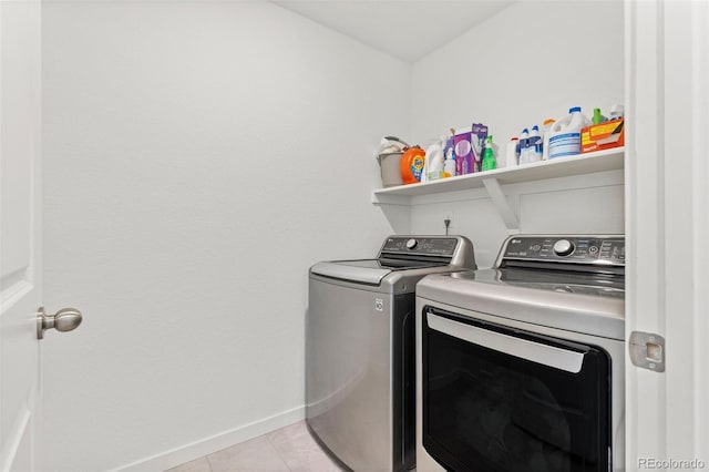 1678 Wright Aly, Erie, CO 80516 - washroom with separate washer and dryer, baseboards, and light tile patterned flooring