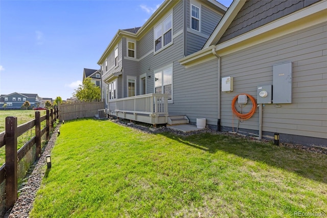 1678 Wright Aly, Erie, CO 80516 - rear view of house featuring cooling unit and a wooden deck
