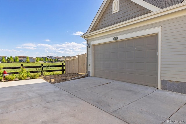 1678 Wright Aly, Erie, CO 80516 - garage with fence and driveway