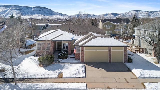 view of front of house with a mountain view and a garage