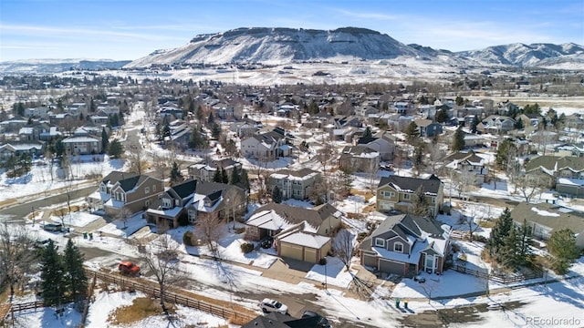 snowy aerial view with a mountain view