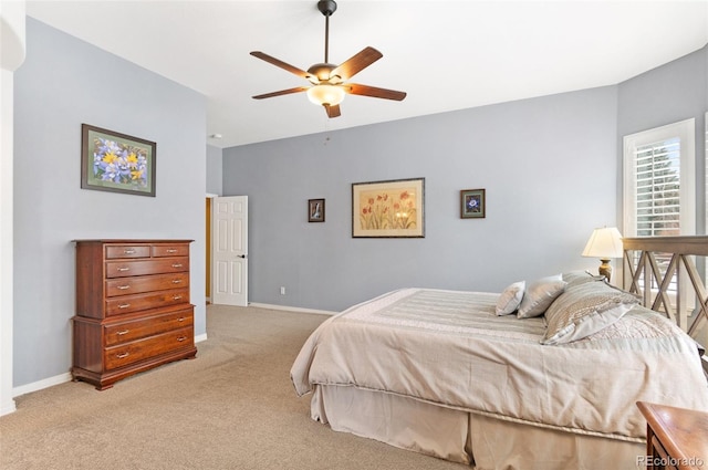 bedroom featuring light colored carpet and ceiling fan