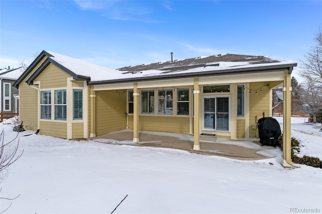 view of snow covered house